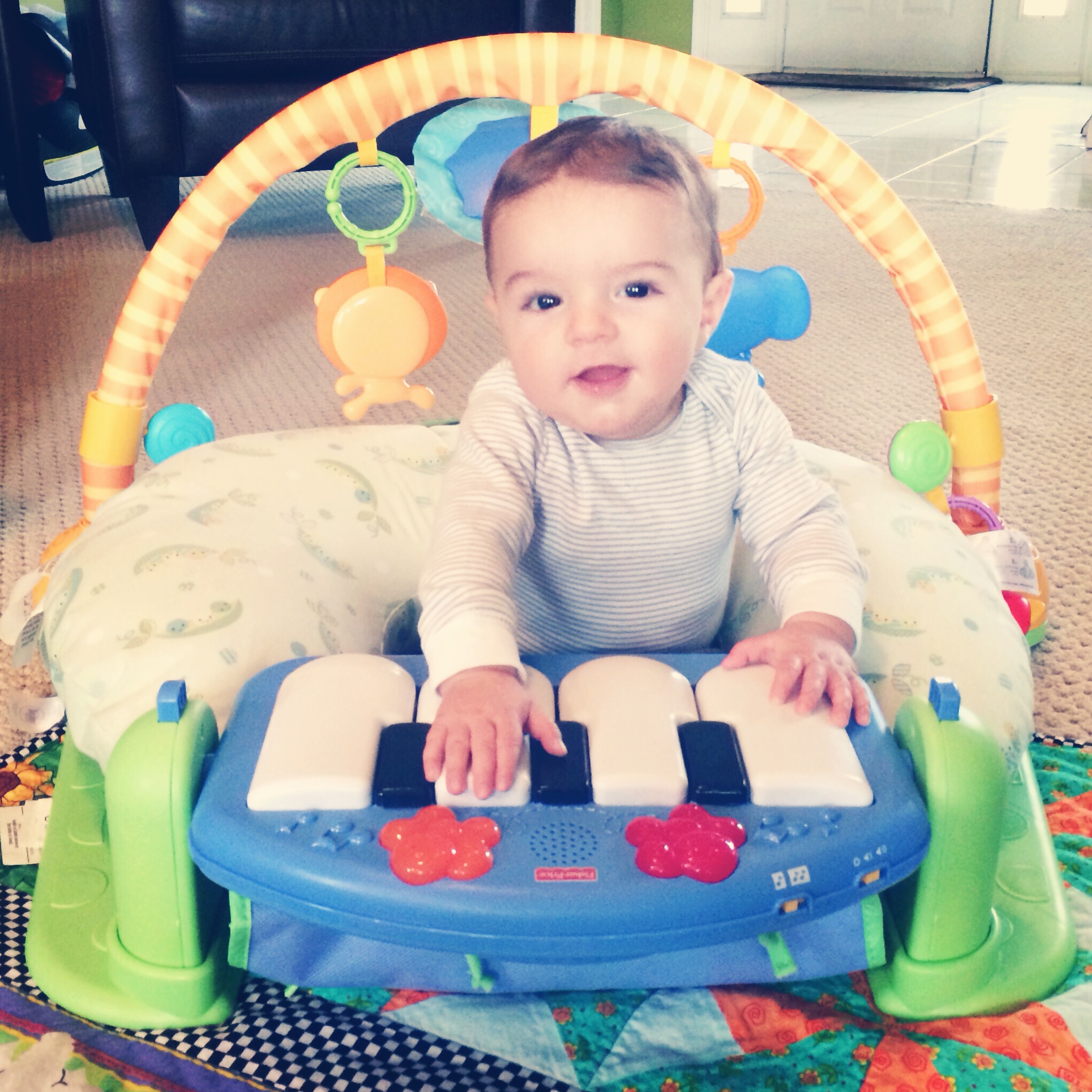 Parker sitting up at the piano